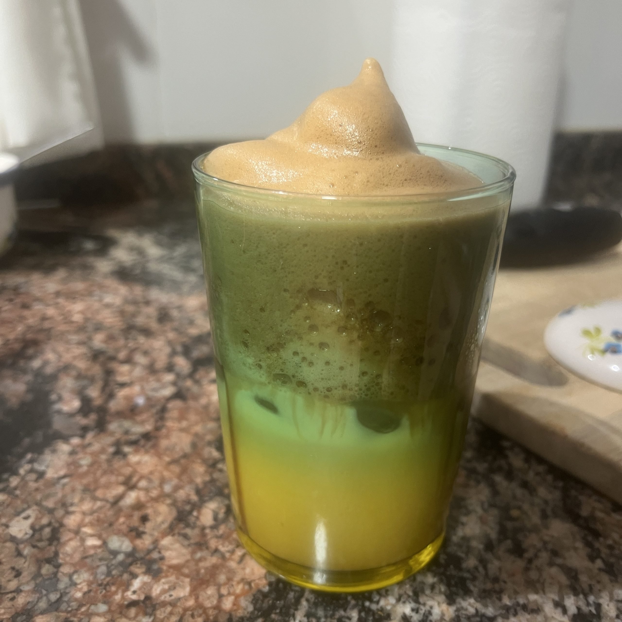 Dalgona whipped coffee over iced milk